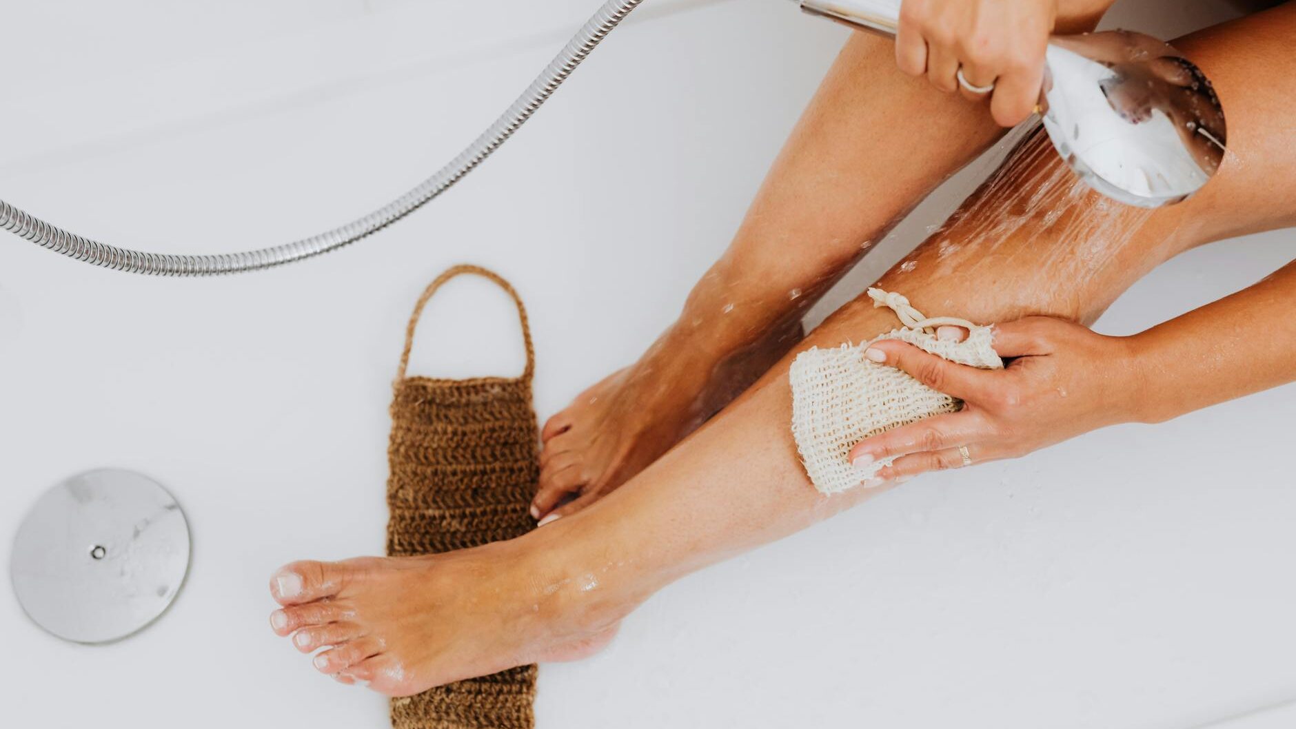 woman massaging leg in bathtub ,
skin itches after showering